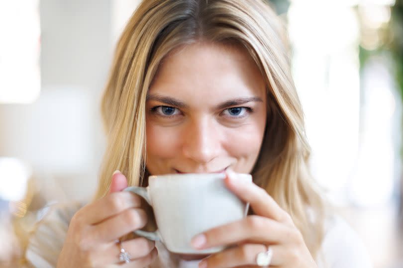 A woman enjoying a cup of coffee