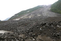 <p>Emergency personnel, in orange, work at the site of a landslide in Xinmo village in Maoxian County in southwestern China’s Sichuan Province, Saturday, June 24, 2017. (Photo: He Qinghai/Xinhua via AP) </p>