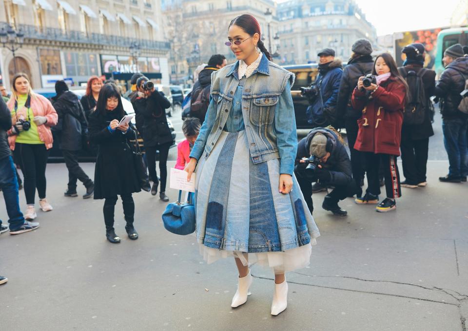 In a Junya Watanabe skirt and with a Gabriela Hearst bag