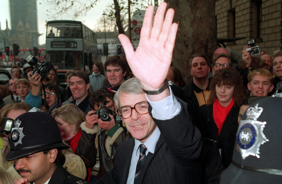 Then Chancellor John Major waves after Margaret Thatcher announced her resignation in 1990, paving the way for him to succeed her inside Number 10.