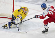 Sweden goaltender Hugo Havelid (35) makes a save against Czechia's Jiri Kulich (25) during the second period of a semifinal hockey game at the IIHF World Junior Hockey Championship in Gothenburg, Sweden, Thursday Jan. 4, 2024. (Christinne Muschi/The Canadian Press via AP)