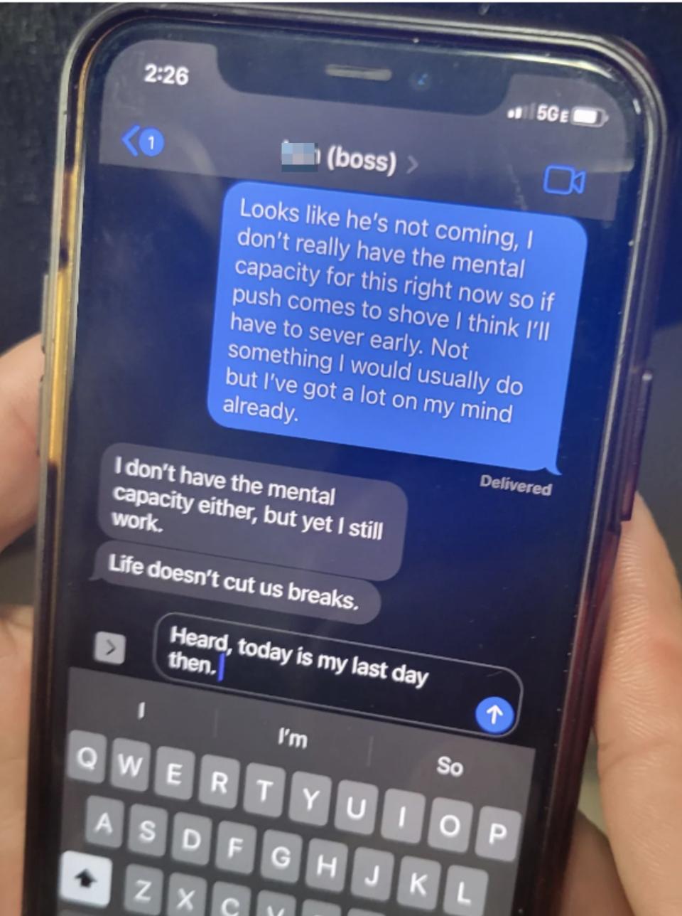 A person holds a phone displaying a text conversation where "Ken (boss)" messages they lack mental capacity to work. The reply states it's the person's last day