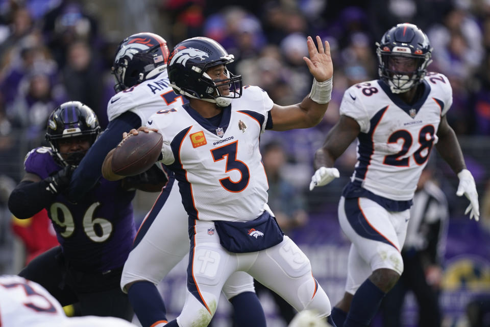 Denver Broncos quarterback Russell Wilson (3) looks to pass in the first half of an NFL football game against the Baltimore Ravens, Sunday, Dec. 4, 2022, in Baltimore. (AP Photo/Patrick Semansky)