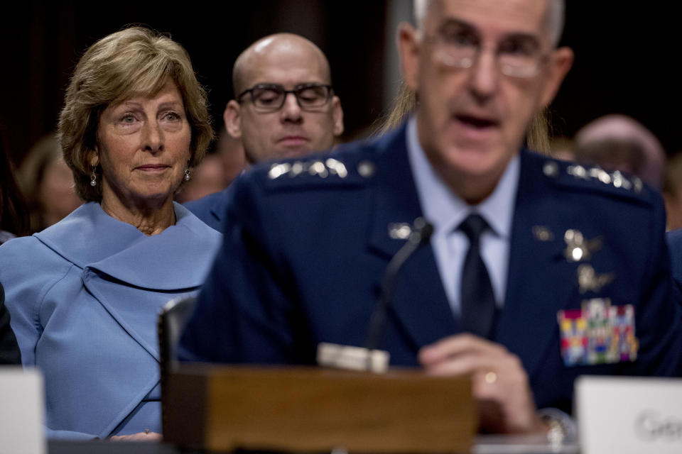 Gen. John Hyten, right, accompanied by his wife Laura, left, speaks before the Senate Armed Services Committee on Capitol Hill in Washington, Tuesday, July 30, 2019, for his confirmation hearing to be Vice Chairman of the Joint Chiefs of Staff. (AP Photo/Andrew Harnik)