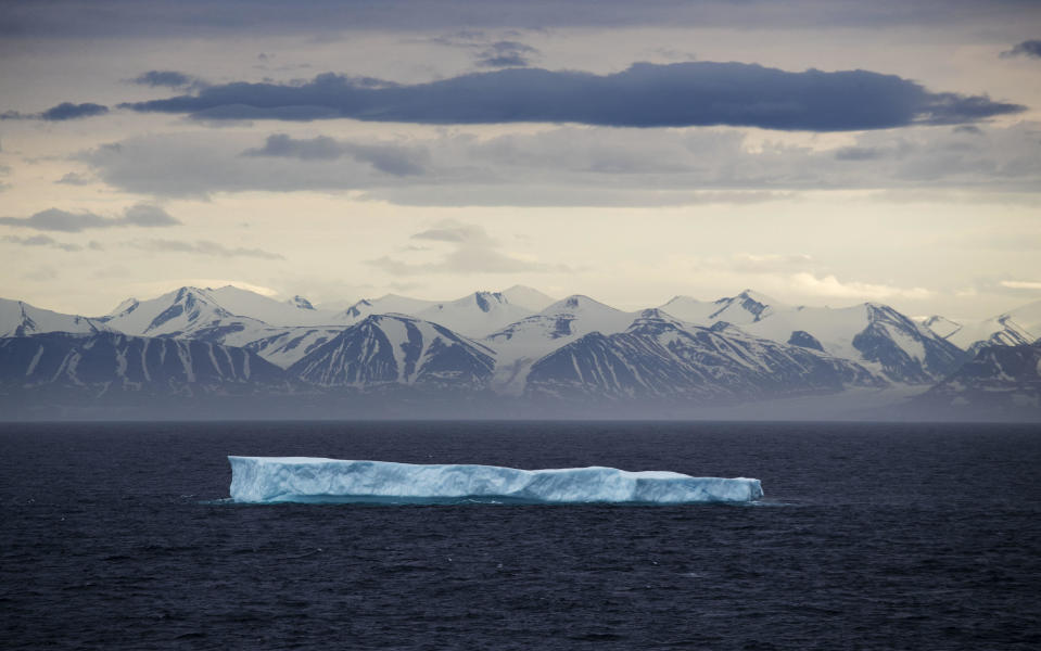 In this July 24, 2017 file photo, an iceberg floats past Bylot Island in the Canadian Arctic Archipelago. NOAA's annual Arctic Report Card, released on Tuesday, Dec. 8, 2020, shows how warming temperatures in the Arctic are transforming the region's geography and ecosystems. / Credit: David Goldman / AP