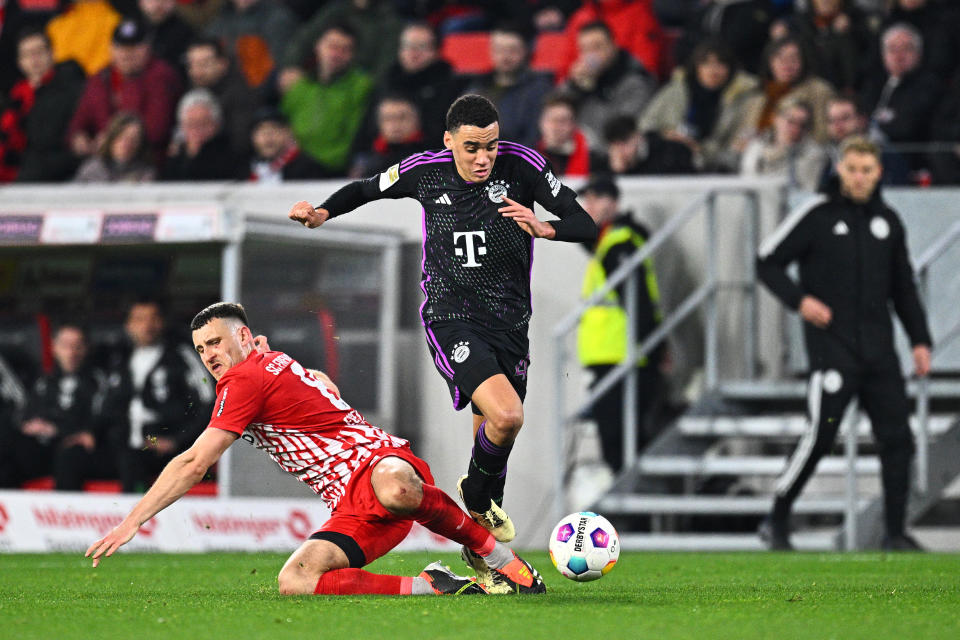 01 March 2024, Baden-Württemberg, Freiburg Im Breisgau: Soccer: Bundesliga, SC Freiburg - Bayern Munich, Matchday 24 at Europa-Park Stadium, Freiburg's Maximilian Eggestein and Munich's Jamal Musiala (r) fight for the ball. IMPORTANT NOTE: In accordance with the regulations of the DFL German Football League and the DFB German Football Association, it is prohibited to use or have used photographs taken in the stadium and/or of the match in the form of sequential images and/or video-like photo series. Photo: Tom Weller/dpa (Photo by Tom Weller/picture alliance via Getty Images)