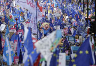 Anti-Brexit remain in the European Union supporters take part in a "People's Vote" protest march calling for another referendum on Britain's EU membership, in London, Saturday, Oct. 19, 2019. Britain's Parliament is set to vote in a rare Saturday sitting on Prime Minister Boris Johnson's new deal with the European Union, a decisive moment in the prolonged bid to end the Brexit stalemate. Various scenarios may be put in motion by the vote. (AP Photo/Matt Dunham)