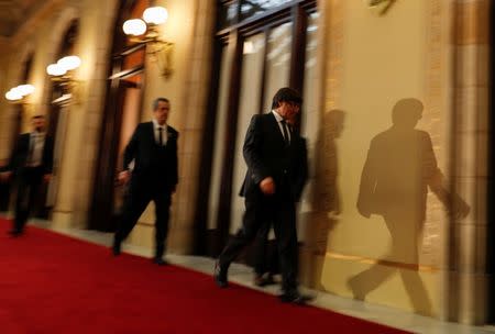 Catalan President Carles Puigdemont walks through a hall at the Catalan regional Parliament in Barcelona, Spain, October 27, 2017. REUTERS/Rafael Marchante