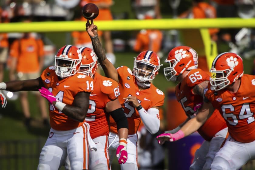 Clemson quarterback D.J. Uiagalelei (5) makes a pass during an NCAA college football game against Syracuse.