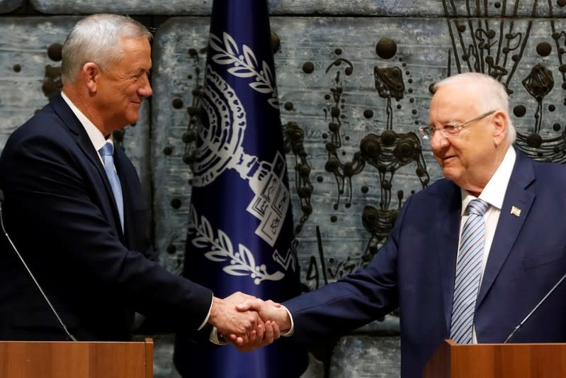 Israeli President Reuven Rivlin and Benny Gantz, leader of Blue and White party, attend a nomination ceremony at the President's residency in Jerusalem