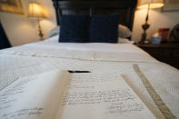 The guest book for the bed-and-breakfast The House of Bise Bespoke rests on a bed, Monday, July 19, 2021, in Cleveland. Small businesses in the U.S. that depend on tourism and vacationers say business is bouncing back, as people re-book postponed trips and take advantage of loosening restrictions, a positive sign for the businesses that have struggled for more than a year. Bise started in 2019 and catered to international tourists, attracting guests from New Zealand, Botswana, Eastern Europe and elsewhere. (AP Photo/Tony Dejak)