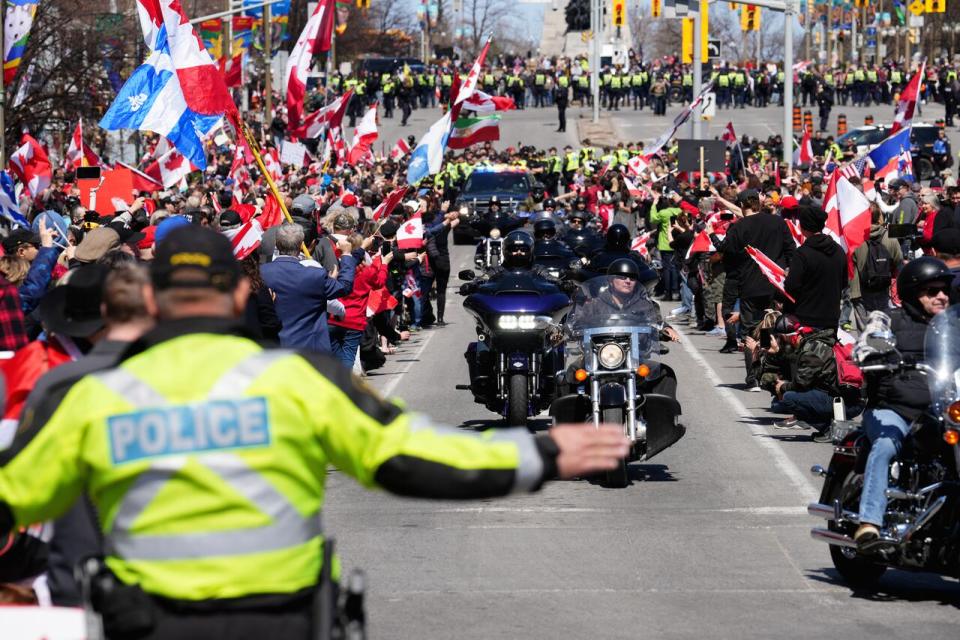 Protesters cheer as motorcyclists pass by during the Rolling Thunder rally in Ottawa April 30, 2022.