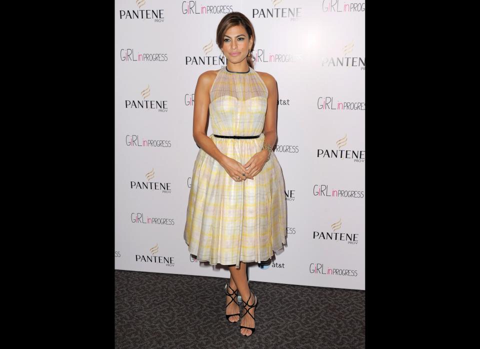 Eva has been doing demure <a href="http://www.stylelist.com/2012/05/02/eva-mendes-style_n_1468726.html" target="_hplink">very well lately</a>. The buttercream yellow emphasizes her best feature--her gorgeous skin. While the pattern could've gone very tablecloth-esque, it's understated enough to look right on a dress. The straps of the shoes, the belt and the detailed neckline add architecture to the look.     Los Angeles, May 2  (Photo Credit: Getty Images)