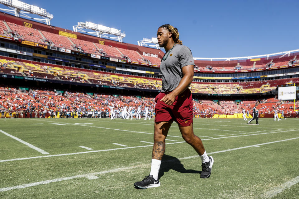 Washington Commanders defensive end Chase Young (99) walks off the field after the second half of a NFL Preseason football game between the Carolina Panthers and the Washington Commanders on Saturday, Aug. 13, 2022 at FedExField in Landover, Md. (Shaban Athuman/Richmond Times-Dispatch via AP)