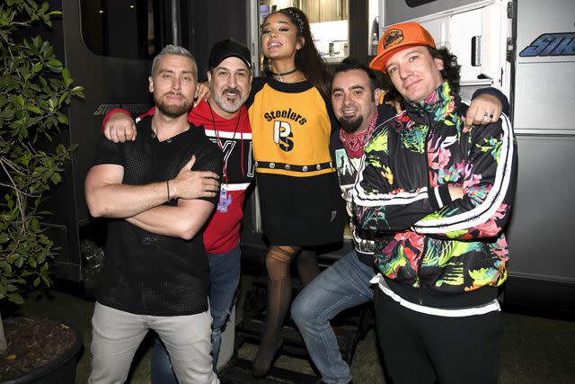 Kevin Mazur/Getty Members of *NSYNC pose with Ariana Grande