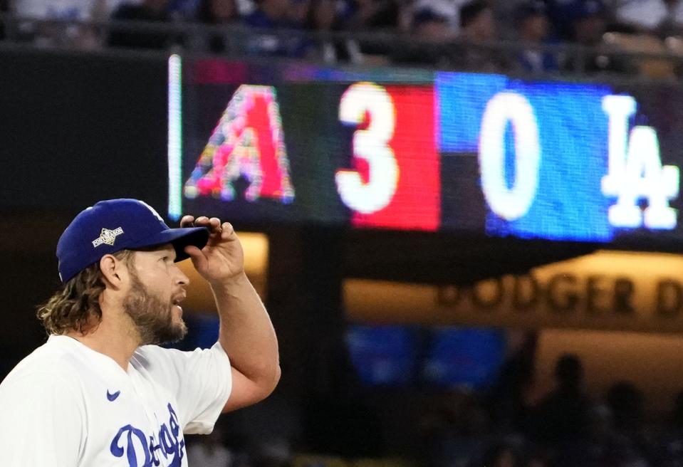 Los Angeles Dodgers starting pitcher Clayton Kershaw reacts after giving up a three-run home run to Arizona Diamondbacks Gabriel Moreno (14) in the first inning during Game 1 of the NLDS at Dodger Stadium in Los Angeles on Oct. 7, 2023.