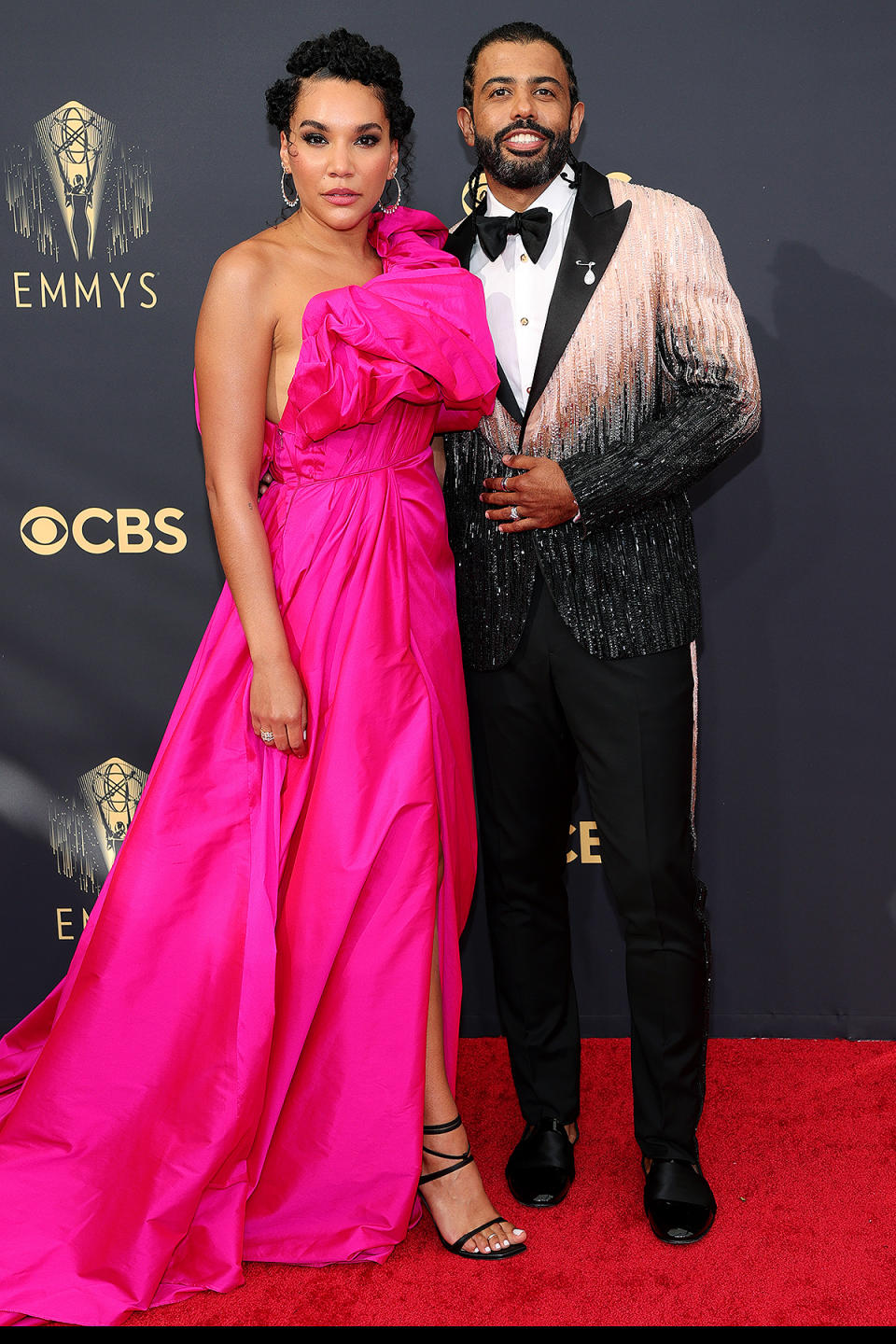 <p>The <em>Hamilton </em>star sparkled and shined on the red carpet in a beaded pink and black tux, matching his partner Emmy Raver-Lampman, who also opted for a pink look. </p>