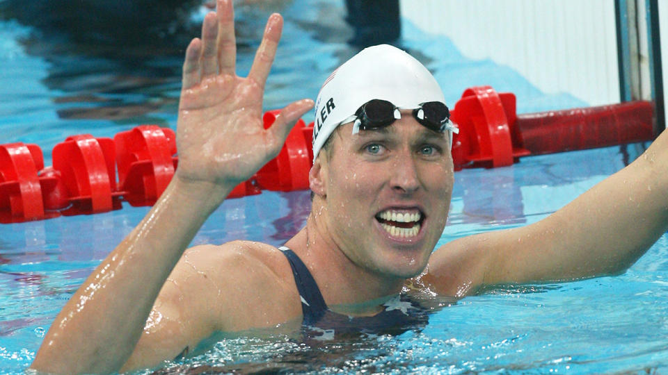 Klete Keller is seen here waving to fans at the end of a swimming race.