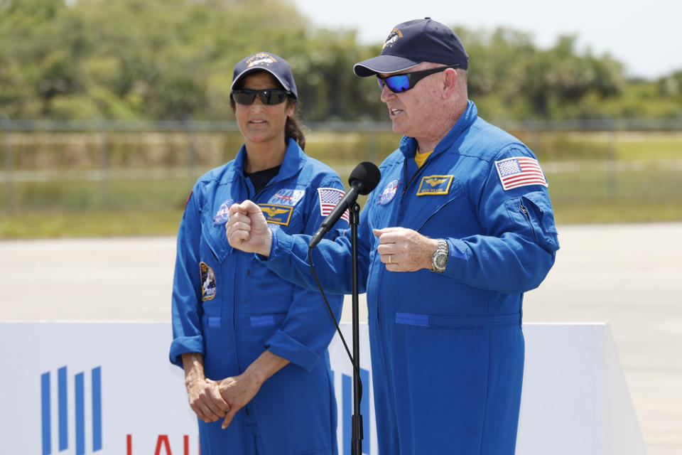NASA astronauts Butch Wilmore, right, and Suni Williams speak to the media after they arrived at the Kennedy Space Center, Thursday, April 25, 2024, in Cape Canaveral, Fla. The two test pilots will launch aboard Boeing’s Starliner capsule atop an Atlas rocket to the International Space Station, scheduled for liftoff on May 6, 2024. (AP Photo/Terry Renna)