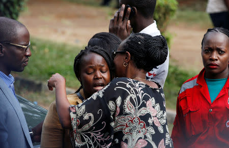 Unidentified relatives react outside the scene where explosions and gunshots were heard at the Dusit hotel compound, in Nairobi, Kenya January 16, 2019. REUTERS/Thomas Mukoya