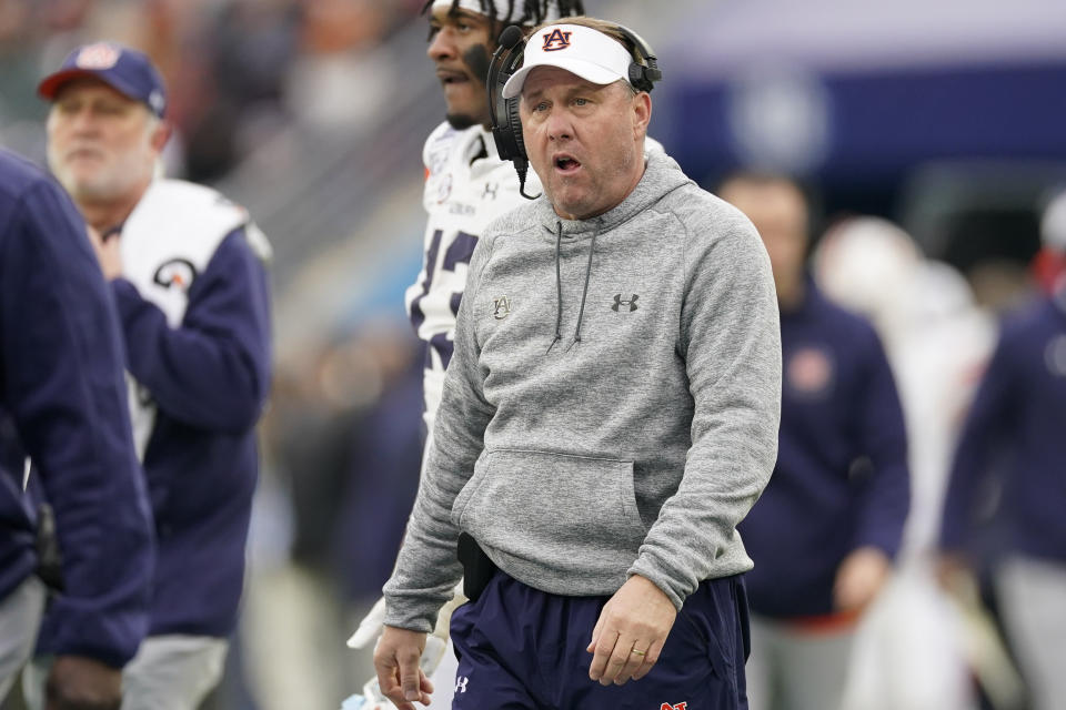 Auburn head coach Hugh Freeze walks onto the field during a timeout in the first half of the Music City Bowl NCAA college football game Saturday, Dec. 30, 2023, in Nashville, Tenn. (AP Photo/George Walker IV)