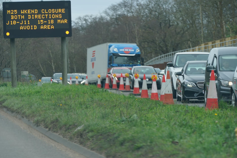 An information sign as traffic builds up in Cobham, Surrey, near to a closed section of the M25 between Junctions 10 and 11, while a bridge is demolished and a new gantry is installed. Picture date: Saturday March 16, 2024. (Photo by Yui Mok/PA Images via Getty Images)