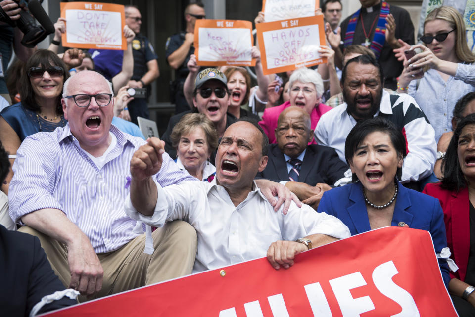 Rep. Joe Crowley (D-N.Y.), left, and other congressional Democrats, participate in a protest in Washington against the Trump administration's family separation policy. (Photo: Tom Williams via Getty Images)