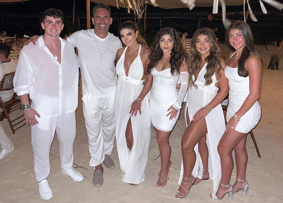 Teresa Giudice, husband Louis Ruelas and and their children (Gia, Milania, Audriana and Louie Jr.) pose for family photo in matching all-white outfits.