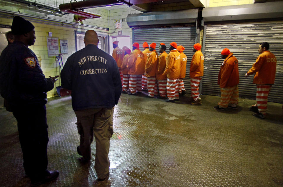 FILE - In this March 16, 2011 file photo, inmates file out of the prison bakery at the Rikers Island jail after working the morning shift, in New York. Nearly a third of Rikers Island inmates who said their visible injuries came at the hands of a correction officer last year had suffered a blow to the head, a tactic that is supposed to be a guard's last resort because it is potentially fatal, according to an internal report obtained by The Associated Press. (AP Photo/Bebeto Matthews, File)