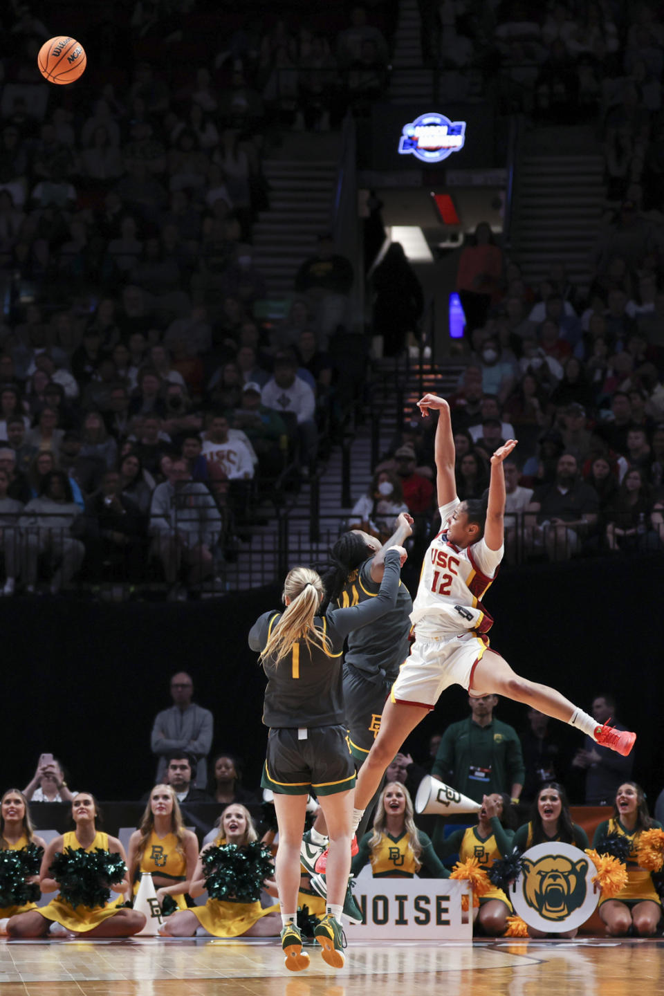 Southern California guard JuJu Watkins (12) shoots as Baylor forward Dre'Una Edwards defends during the first half of a Sweet 16 college basketball game in the women's NCAA Tournament, Saturday, March 30, 2024, in Portland, Ore. (AP Photo/Howard Lao)