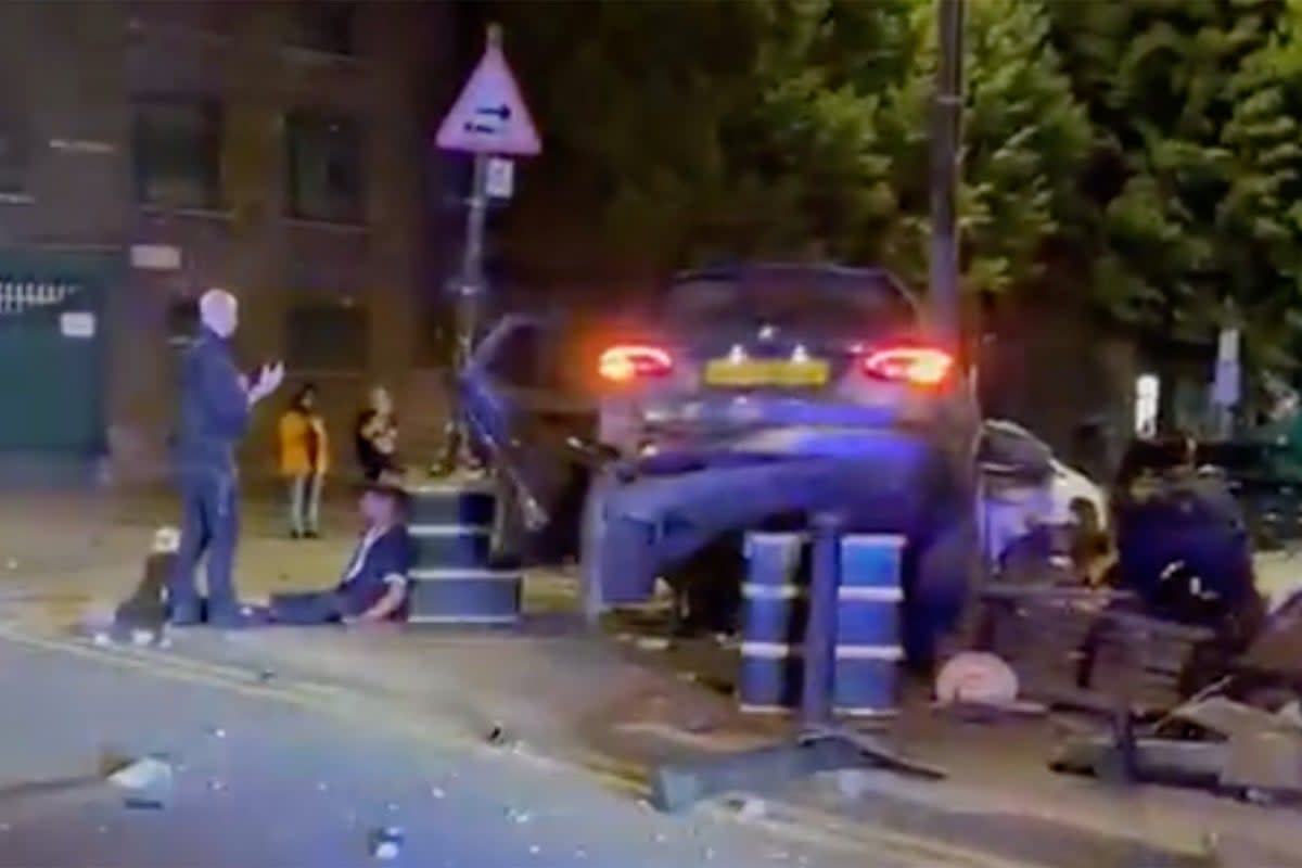 The car failed to stop for police before smashing into a bench  (@CrimeLdn/X)
