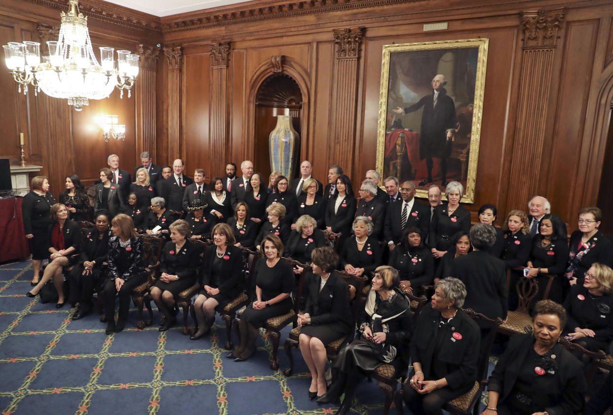 House Minority Leader Nancy Pelosi, D-Calif., center seated, with other House members wearing black in support the #MeToo and Time’s Up movements, pose for a group photo ahead of tonight’s State of the Union address on Capitol Hill in Washington, Jan. 30, 2018. (Photo: Pablo Martinez Monsivais/AP)