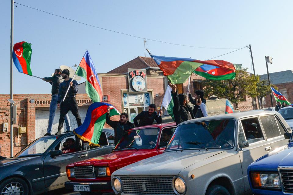 Azerbaijanis celebrate waving national flags in the center of Ganja, Azerbaijan’s second largest city, near the border with Armenia, Azerbaijan (AP Photo/Aydin Mammedov)AP
