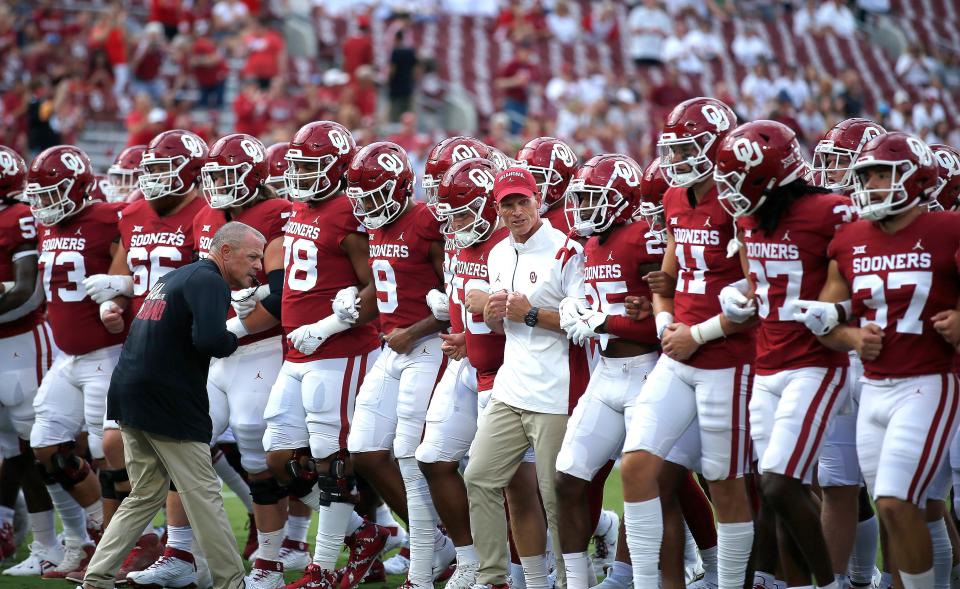 OU football coach Brent Venables lines up with player before facing Kent State at Gaylord Family-Oklahoma Memorial Stadium in Norman on Sept., 10, 2022.