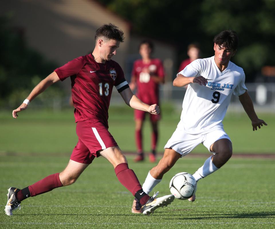 Arlington's Alex Sturans is covered by John Jay's Andres Melendez during a Sept. 13, 2023 boys soccer game.