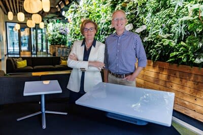 Margherita Della Valle, Vodafone Group Chief Executive, and Dave Limp, Amazon Senior Vice President of Devices and Services. The customer terminal antennas featured are used to send and receive data to and from Project Kuiper satellites.