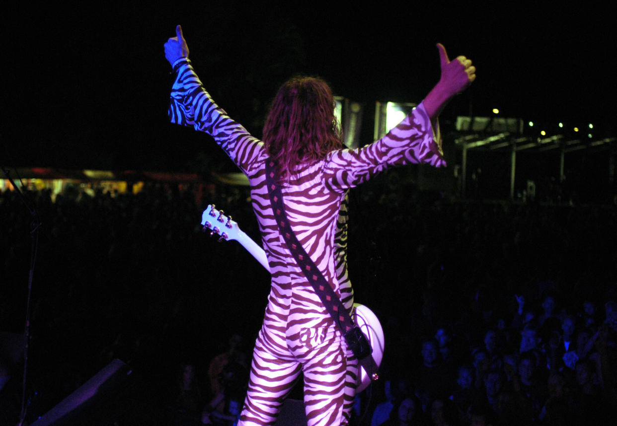 Justin Hawkins in one of his famous catsuits. (Photo: Lex van Rossen/MAI/Redferns)