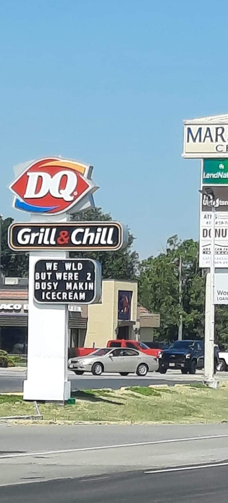 The Marshfield Dairy Queen outdoor sign reads, "WE WLD BUT WERE 2 BUSY MAKIN ICECREAM."