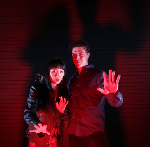 LOS ANGELES, CA - NOVEMBER 11, 2022 - - Actors Constance Wu, left, and Finn Wittrock star In Center Theatre Group's latest play, "2:22 A Ghost Story," about a young family who is haunted by a mysterious force at the Ahmanson Theatre in Los Angeles on November 11, 2022. 2:22 A Ghost Story is a thriller play by Danny Robins. It premiered in the West End in 2021, and received a Laurence Olivier Award nomination for Best New Play the following year. (Genaro Molina / Los Angeles Times)