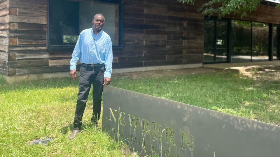 Patrick Braxton stands by the Newbern Town Hall, a building he says he's been locked out of.  - Meridith Edwards/CNN