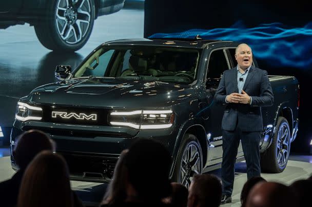 PHOTO: Mike Koval, chief executive officer of Ram Brand, speaks next to a 2024 RAM 1500 REV electric pickup during the 2023 New York International Auto Show (NYIAS), April 5, 2023, in New York. (Jeenah Moon/Bloomberg via Getty Images)