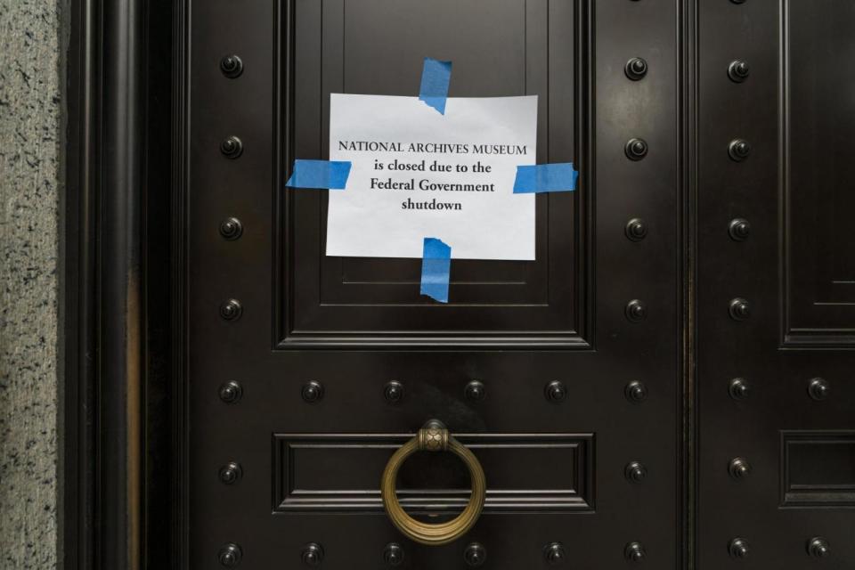 Shutdown: closed sign taped to the doors of the National Archives (EPA)