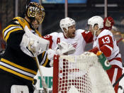 Detroit Red Wings' Pavel Datsyuk (13) is congratulated by teammate Johan Franzen after scoring against Boston Bruins goalie Tuukka Rask, left, during the third period of Detroit's 1-0 win in Game 1 of a first-round NHL playoff hockey series, in Boston on Friday, April 18, 2014. (AP Photo/Winslow Townson)