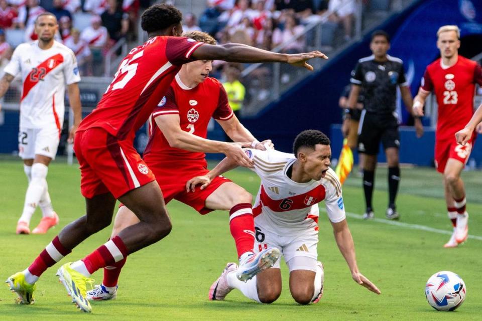 Peru defender Marcos López (6) is fouled by Canada defender Alistair Johnston (2) during a Group A Copa America 2024.