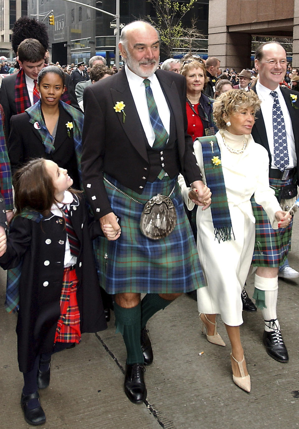 FILE - In this file photo dated Saturday, April 6, 2002, Scottish actor Sean Connery, center, leads a procession up New York's Sixth Avenue as part of a bagpipe band of about 10,000, billed as the world's largest pipe and drum parade. The parade was to benefit cancer victims through the Marie Curie Cancer Care organization, and the New York-based Gilda's Club Worldwide, a support network named after the late actress Gilda Radner. Scottish actor Sean Connery, considered by many to have been the best James Bond, has died aged 90, according to an announcement from his family. (AP Photo/ Stephen Chernin, FILE)