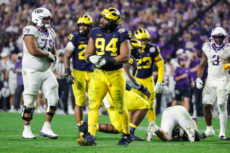 Michigan defensive lineman Kris Jenkins (94) celebrates a play against TCU during the second half at the Fiesta Bowl at State Farm Stadium in Glendale, Ariz. on Saturday, Dec. 31, 2022.