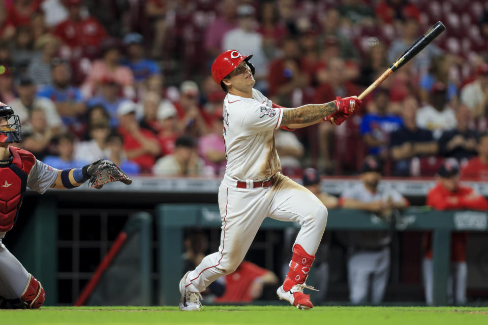 Cincinnati Reds' Nick Senzel watches his walkoff sacrifice fly during the 10th inning of a baseball game against the St. Louis Cardinals in Cincinnati, Monday, May 22, 2023. (AP Photo/Aaron Doster)