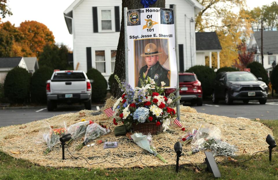 A memorial for Staff Sgt. Jesse Sherrill, the New Hampshire State Police trooper from Barrington who died when a tractor trailer collided with his cruiser on Interstate 95, rests outside Wiggin-Purdy-McCooey-Dion Funeral Home in Dover Nov. 2, 2021.