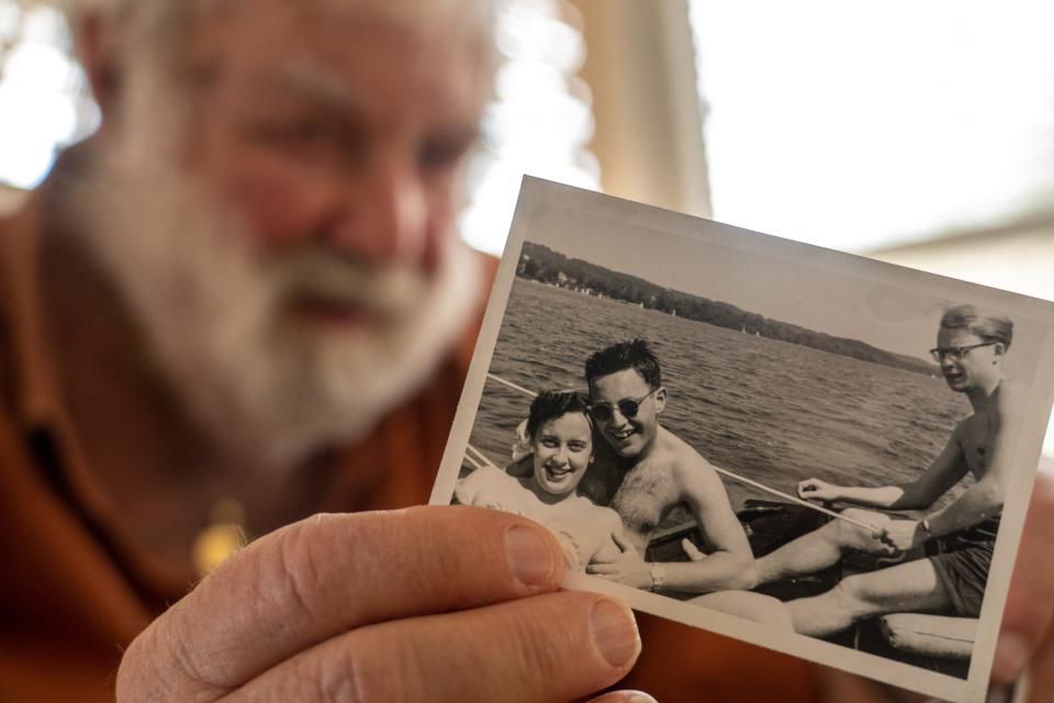 Werner Salinger, 90, a U.S. Air Force Intelligence veteran who enlisted during the Korean War, sorts through photographs and letters written by his wife, Martha Salinger, 89, at their home in Gold Canyon, Arizona, on Jan. 13, 2023. Werner, who survived the Holocaust with his family, met Martha during the height of the Cold War while deployed in Germany. Martha's father, a government bureaucrat, was drafted into the German military during World War II.