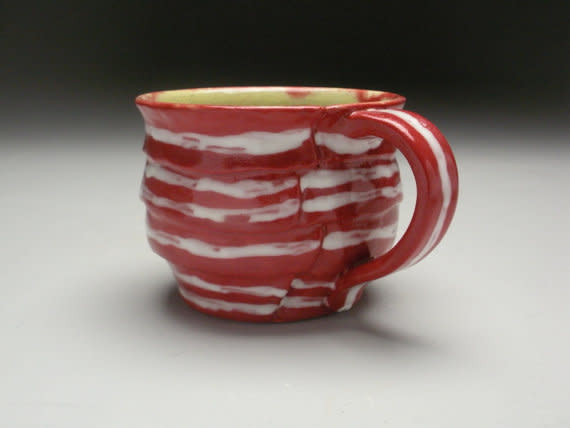 Once your breakfast bacon is gone, you can still commemorate it with this bacon coffee mug.   <a href="http://www.etsy.com/listing/116554569/ceramic-bacon-mug?ref=sr_gallery_40&ga_search_query=bacon&ga_view_type=gallery&ga_ship_to=US&ga_page=11&ga_search_type=all">Etsy</a>, <strong>$25</strong>